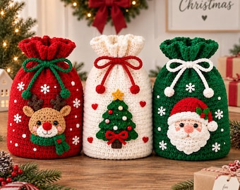 May include: Three crochet drawstring gift bags featuring holiday designs. The red bag has a reindeer, the white bag has a Christmas tree, and the green bag has a Santa Claus face. Each bag is decorated with white crocheted snowflakes and drawstrings.
