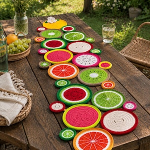May include: A collection of circular crochet coasters and mats designed to resemble various sliced fruits, including watermelon, kiwi, orange, and dragon fruit, featuring vibrant colours like red, green, orange, pink, and white in a variety of sizes.
