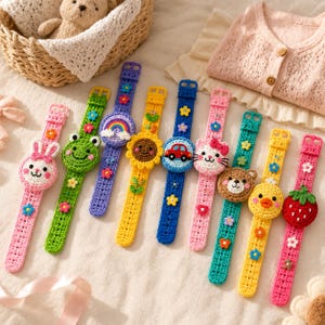 May include: A collection of nine colorful crochet wristbands featuring various decorative motifs including a rabbit, frog, rainbow, sunflower, car, cat, bear, chick, and strawberry, each accented with small crocheted flowers along the strap.