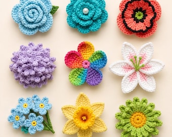May include: A collection of nine handcrafted crochet flowers in various shapes and colors, including a light blue rose, a teal flower with a pearl center, a coral poppy, a purple hydrangea, a rainbow-colored blossom, a white lily, blue forget-me-nots, a yellow daffodil, and a green daisy.