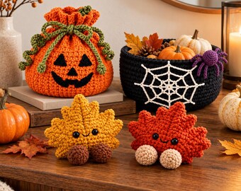 May include: A crochet pumpkin drawstring bag with a jack-o'-lantern face, a black crochet basket featuring a white spiderweb design, and two small crochet maple leaf figures with black eyes and round feet in yellow and orange.