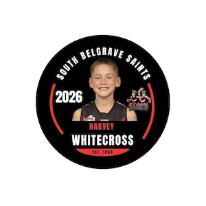 May include: A circular graphic featuring a portrait of a young athlete in a black jersey. Text reads SOUTH BELGRAVE SAINTS, 2026, HARVEY WHITECROSS, and EST. 1969. A small logo shows two figures in red and black uniforms with the text SAINTS.