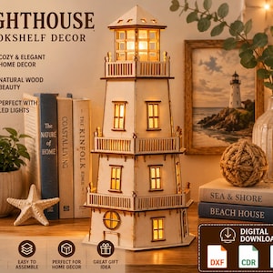 May include: A light-colored wooden lighthouse model featuring multiple levels with railings, rectangular windows, and a glowing interior light. The structure is laser-cut with visible joints and includes text reading LIGHTHOUSE BOOKSHELF DECOR.