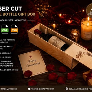 May include: A rectangular wooden wine bottle gift box with a sliding lid featuring a laser-cut grape vine design. The box contains a wine bottle and is accompanied by a card with the text Happy Anniversary. Includes digital file formats DXF, CDR, and SVG.