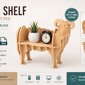 May include: A laser cut file for a ram-shaped shelf, designed for 1/4 inch plywood. The digital download includes DXF, CDR, and SVG formats. The assembled light-colored wooden shelf features a ram head and legs, holding a small plant and clock.