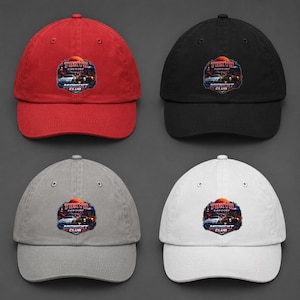 May include: Four baseball caps in red, black, grey, and white. Each cap displays a circular graphic with the text "TOKYO" above a car scene and "MIDNIGHT CLUB" below. The caps have a curved peak and an adjustable strap.