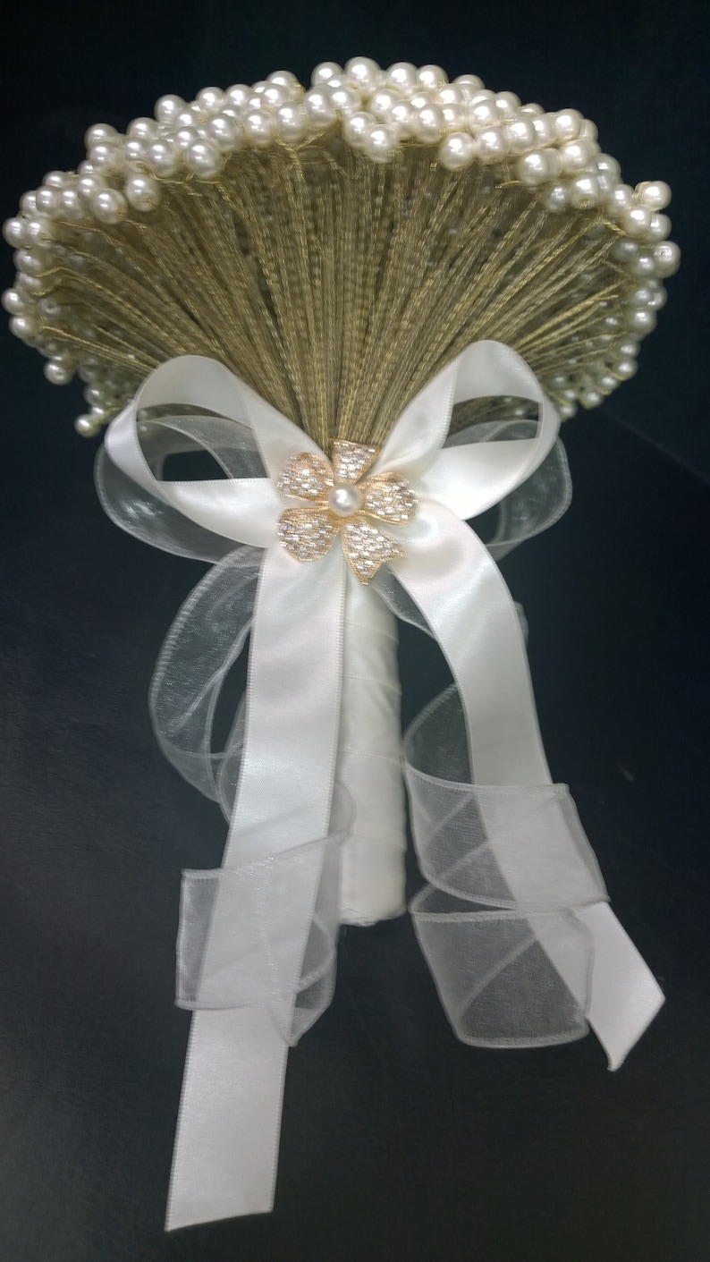 Perfect for a vintage wedding Pearl brides bouquet