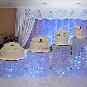 Wedding cake stand [ Crystal cake stand, 4 tiers crystal wedding cake holder cascading display stand plus LED lights by Crystal wedding uk
