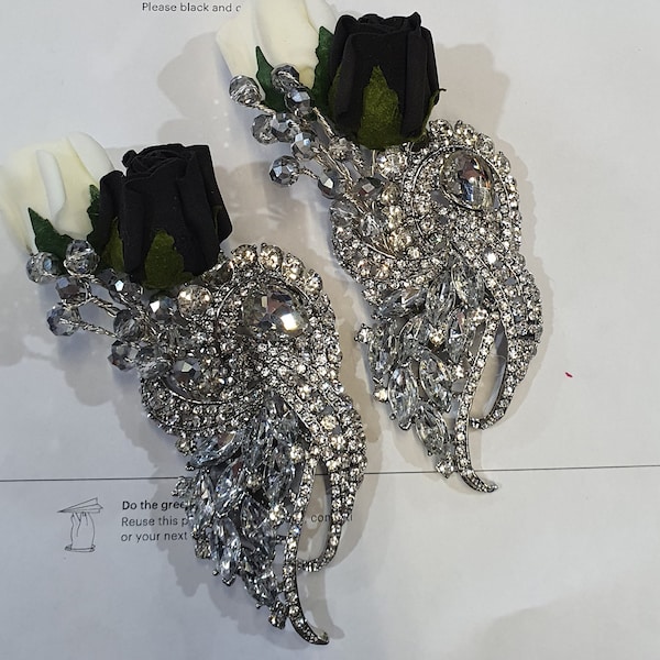 Crystal brooch  buttonhole  with  ivory and black foam roses by Crystal wedding uk