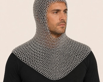 May include: A silver chainmail coif, covering the head and shoulders. The coif is made of small, interlocking metal rings, creating a flexible yet protective garment. The coif is worn over a black long-sleeved shirt.