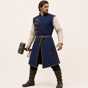 May include: A dark blue quilted sleeveless tunic featuring a high collar, brown leather straps with buckles, and a diamond-stitched pattern. The garment is worn over a light-coloured long-sleeved shirt and black trousers, paired with brown leather boots.
