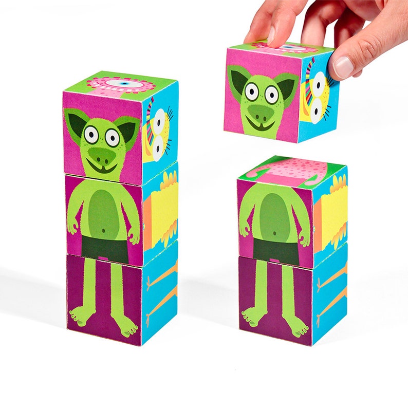 K&ouml;nnte beinhalten: Ein Set aus bunten Holzw&uuml;rfeln mit verschiedenen Comic-Monsterfiguren. Jeder W&uuml;rfel zeigt einen anderen Teil des Monsters, wie Kopf, Rumpf, Beine und Arme. Die W&uuml;rfel k&ouml;nnen gestapelt werden, um ein vollst&auml;ndiges Monster zu erstellen.