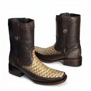 May include: Brown leather ankle boots with a snakeskin pattern on the foot and a textured design on the upper shaft. The boots have a square toe and a zip closure. A silver button is on the side of the boot.