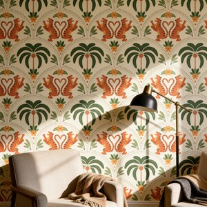 May include: Wallpaper featuring a repeating pattern of orange tigers with tails forming heart shapes, interspersed with green palm trees and small yellow flowers on a cream background. A black floor lamp stands in front of the wall.