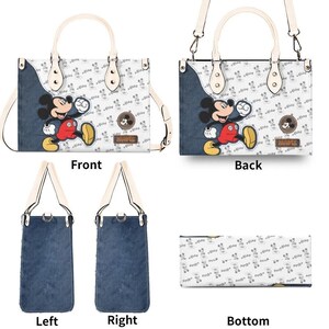 May include: A rectangular handbag featuring a Mickey Mouse design. The bag has a white background with a repeating Mickey Mouse pattern, denim-like side panels, and a Mickey Mouse graphic. It includes a top handle and a detachable shoulder strap.