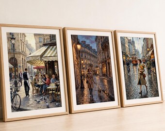 May include: Three framed vertical art prints in light wood frames. The left print shows a Parisian cafe scene with patrons and a waiter. The center print depicts a person walking a dog on a wet city street. The right print shows a person with flowers.