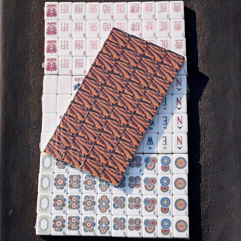 Tiger Mahjong tile set with tiger stripe backs, safari themed Mahjong tiles, custom American Mahjong set, jungle inspired Mahjong game, luxury Mahjong tiles, wildlife Mahjong collection, animal print Mahjong set, premium Mahjong tiles, collector Mahjong gift, exotic Mahjong design, tiger pattern game tiles, custom Mahjong accessories, unique Mahjong set