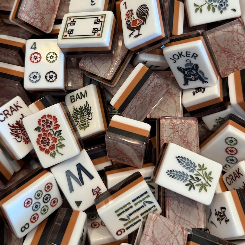 Terracotta Marble Tile Set close-up showing detailed flower, dragon, and character tiles, luxury mahjong