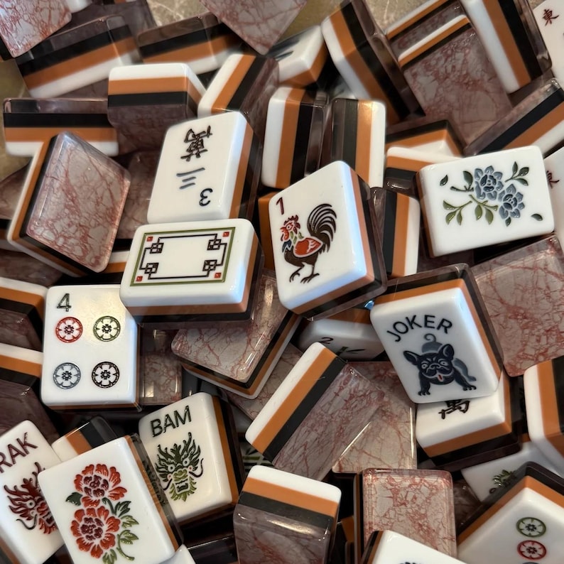 Terracotta Marble Tile Set close-up showing detailed flower, dragon, and character tiles, luxury mahjong