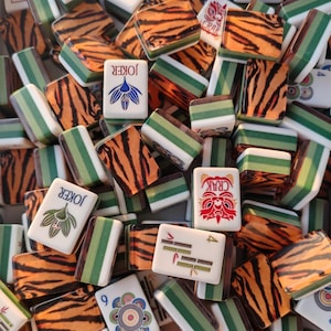 Tiger Mahjong tile set with tiger stripe backs, safari themed Mahjong tiles, custom American Mahjong set, jungle inspired Mahjong game, luxury Mahjong tiles, wildlife Mahjong collection, animal print Mahjong set, premium Mahjong tiles, collector Mahjong gift, exotic Mahjong design, tiger pattern game tiles, custom Mahjong accessories, unique Mahjong set