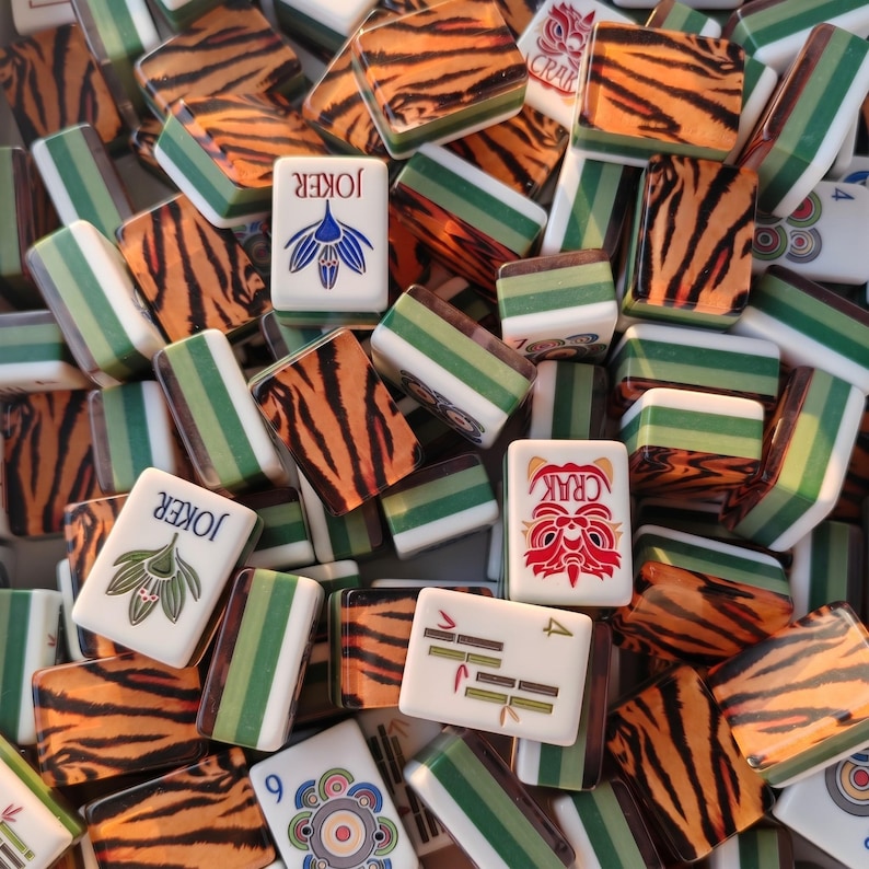 Tiger Mahjong tile set with tiger stripe backs, safari themed Mahjong tiles, custom American Mahjong set, jungle inspired Mahjong game, luxury Mahjong tiles, wildlife Mahjong collection, animal print Mahjong set, premium Mahjong tiles, collector Mahjong gift, exotic Mahjong design, tiger pattern game tiles, custom Mahjong accessories, unique Mahjong set