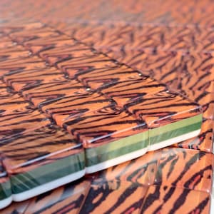 Tiger Mahjong tile set with tiger stripe backs, safari themed Mahjong tiles, custom American Mahjong set, jungle inspired Mahjong game, luxury Mahjong tiles, wildlife Mahjong collection, animal print Mahjong set, premium Mahjong tiles, collector Mahjong gift, exotic Mahjong design, tiger pattern game tiles, custom Mahjong accessories, unique Mahjong set