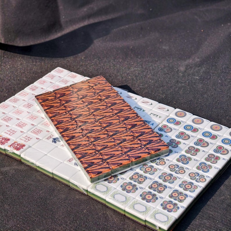 Tiger Mahjong tile set with tiger stripe backs, safari themed Mahjong tiles, custom American Mahjong set, jungle inspired Mahjong game, luxury Mahjong tiles, wildlife Mahjong collection, animal print Mahjong set, premium Mahjong tiles, collector Mahjong gift, exotic Mahjong design, tiger pattern game tiles, custom Mahjong accessories, unique Mahjong set