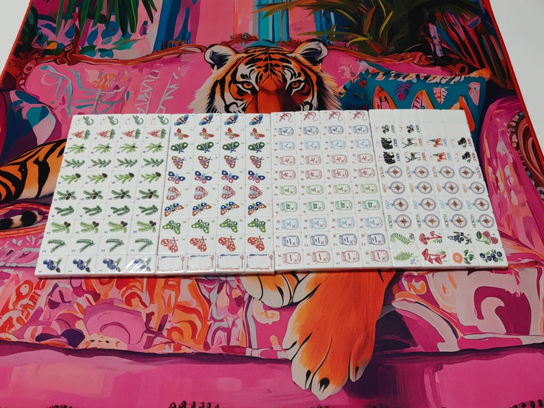 Nature inspired American Mahjong tile set with woodland illustrations, butterfly dot tiles, pine branch bam tiles, firefly mason jar craks, mushroom flower tiles, compass wind tiles, whimsical forest Mahjong set, cottagecore Mahjong tiles, collectible Mahjong game set, luxury Mahjong tiles, aesthetic board game décor, botanical Mahjong collection, artistic Mahjong gift for nature lovers and cozy game nights