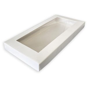 May include: A rectangular white cardboard box featuring a large, clear plastic window on the top lid. The box has a clean, flat surface and is designed with a simple, functional structure for packaging items whilst keeping them visible.