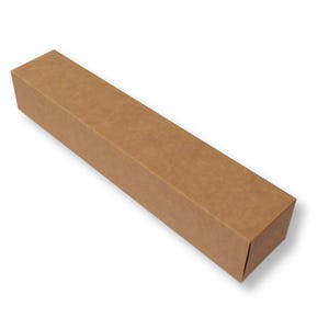May include: A long, rectangular box made of brown kraft paper material. The box features a simple, clean design with a smooth surface and sharp, folded edges, presented in a high-angle view against a plain white background.