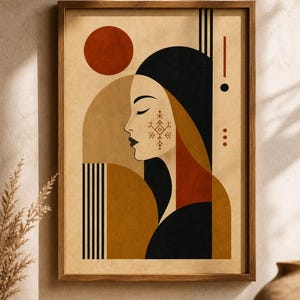 May include: Abstract art print in a wooden frame. The artwork features a woman's profile with closed eyes, a geometric design on her cheek, and a black head covering. Earth tones of brown, orange, and black are used in the design.