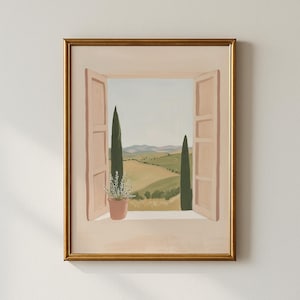 May include: A framed painting of a Tuscan landscape seen through an open window. The artwork has a gold frame, soft pink window shutters, and a terracotta pot with white flowers. The scene includes rolling hills, cypress trees, and a pale blue sky.