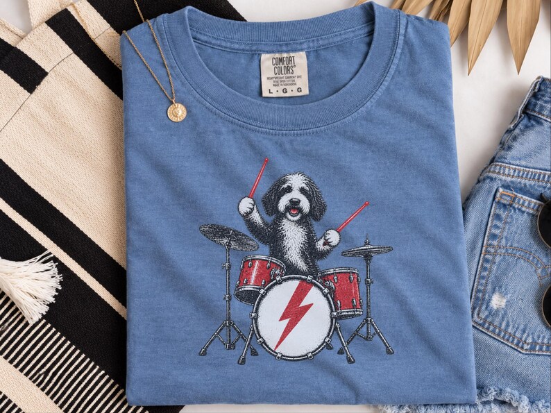 Rockmusiker, trummis, presentidé, hundälskare, rockstjärna, hund bild 1