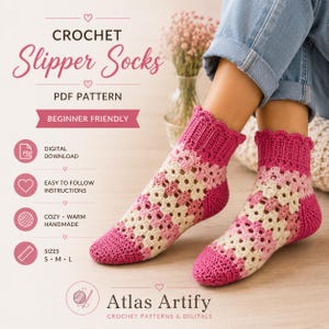 May include: A pair of handmade crochet slipper socks in shades of pink and cream. The socks feature a lacy pattern and a scalloped edge. The image includes text that reads "CROCHET Slipper Socks PDF Pattern Beginner Friendly".