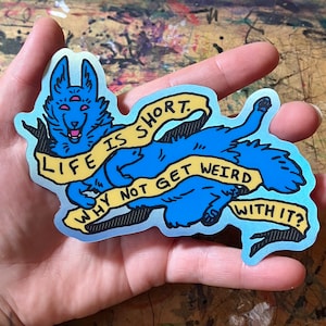 May include: A blue and yellow sticker with a cartoon wolf and the text "Life is short. Why not get weird with it?"