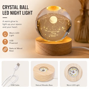 May include: A clear crystal ball night light featuring an internal moon and constellation engraving, resting on a circular natural wood base with a warm LED light. The text reads: CRYSTAL BALL LED NIGHT LIGHT, The Day You Became My Mom, Mommy, 11.28.2023, NEW YORK, pathway. Includes a USB cable.