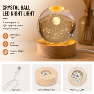 May include: A clear crystal ball night light featuring an internal moon and constellation engraving, resting on a circular natural wood base with a warm LED light. The text reads CRYSTAL BALL LED NIGHT LIGHT, The Day You Became My Mom, Mommy, 11.28.2023, NEW YORK.