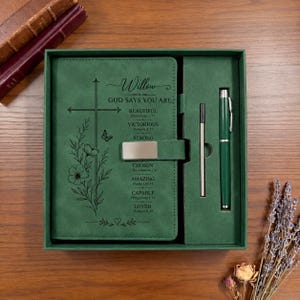May include: A green journal set featuring a cross and floral design with the text Willow God Says You Are Beautiful, Victorious, Strong, Chosen, Amazing, Capable, Loved, including a matching green pen and a slim metal stylus in a box.
