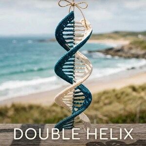 May include: A crochet wind spinner shaped like a double helix in teal and cream yarn, suspended by a twine string. The text reads PDF CROCHET PATTERN, DOUBLE HELIX, WIND SPINNER PATTERN, and Fluffy Loop Crafts. The design features a spiral structure.