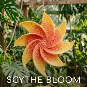 May include: A crochet wind spinner with a spiral flower shape in a yellow to orange gradient. The text reads PDF CROCHET PATTERN, SCYTHE BLOOM, WIND SPINNER PATTERN, and Fluffy Loop Crafts. The object hangs from a string with a wooden bead.