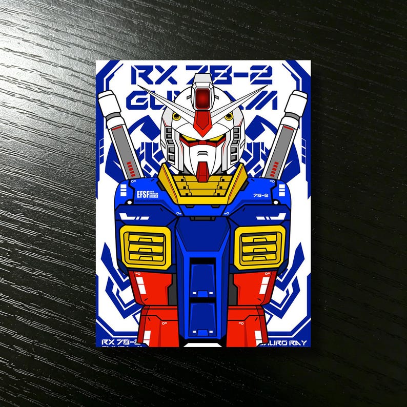 May include: A rectangular sticker featuring a stylized illustration of the RX-78-2 Gundam. The robot is depicted in a bold, colorful design with blue, red, yellow, and white accents. The sticker includes the text "RX 78-2" and "EFSF".