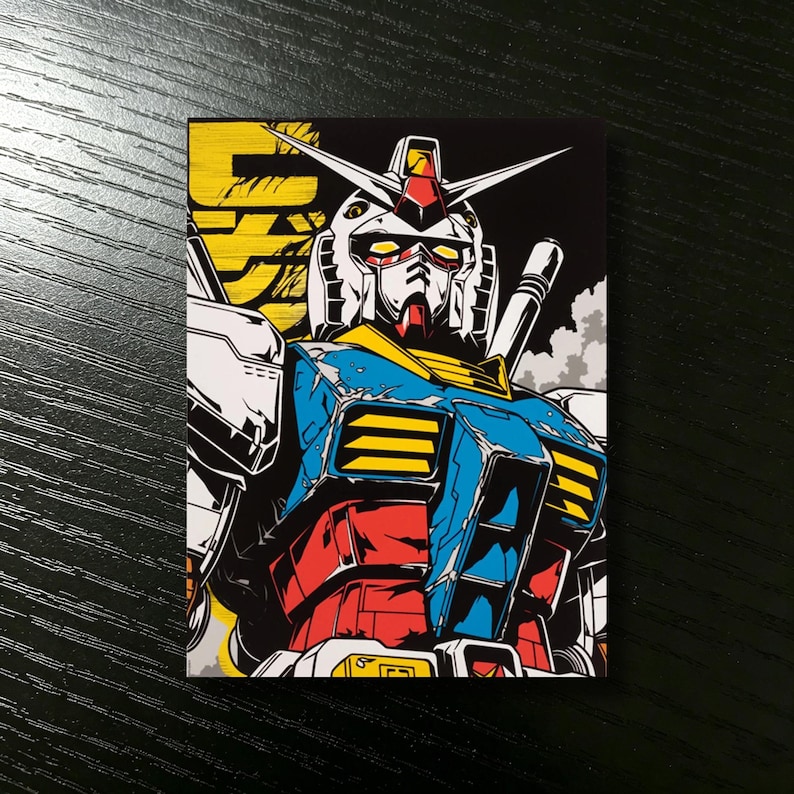 May include: A colorful illustration of a Gundam robot. The robot is depicted in a dynamic pose with a detailed design, featuring red, blue, yellow, and white accents against a black background. The image has a bold, graphic style.