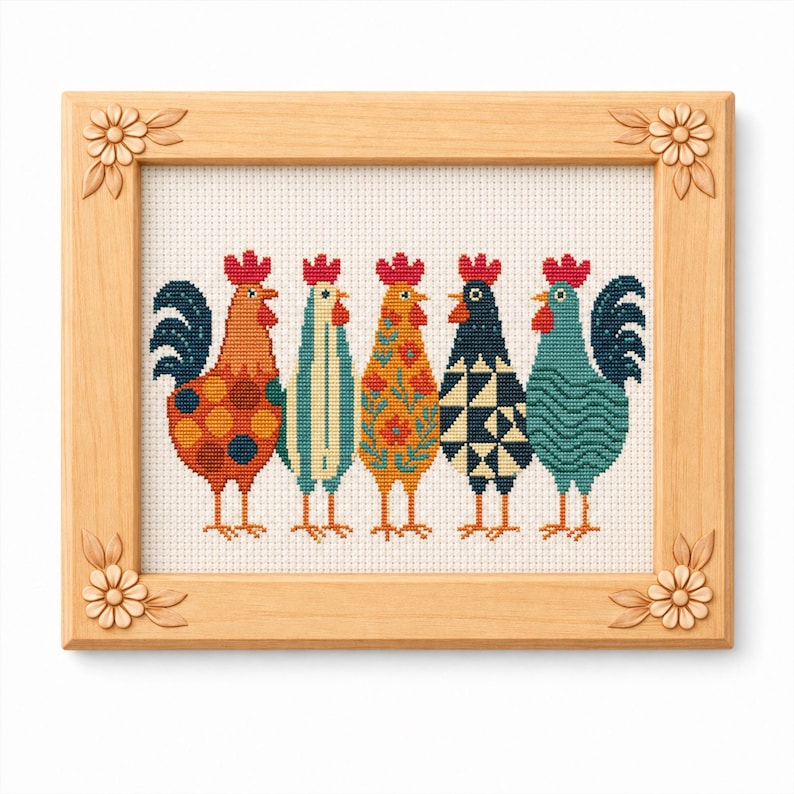 May include: A framed cross-stitch artwork featuring five colorful rooster designs. Each rooster has a unique pattern, including polka dots, stripes, and floral motifs. The frame is made of light-colored wood with floral corner accents.