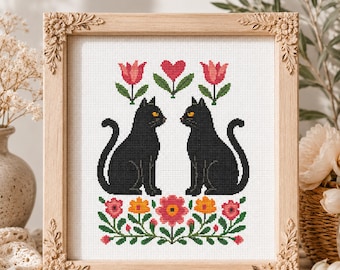 Patrón de punto de cruz de corazón de gato negro en PDF con diseño floral de San Valentín.