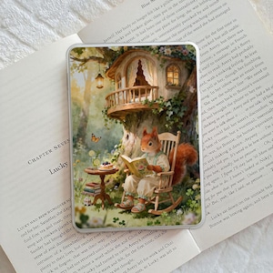 May include: A whimsical illustration on a phone case features a squirrel reading a book in a treehouse. The scene includes a small table with snacks and a butterfly, evoking a storybook aesthetic.