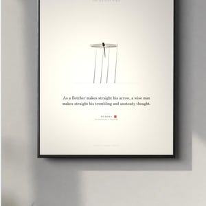May include: A framed wall art print on a cream background featuring a minimalist black dragonfly illustration and the text: As a fletcher makes straight his arrow, a wise man makes straight his trembling and unsteady thought. Buddha.