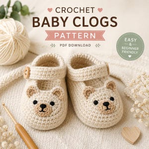 May include: A pair of cream-colored crochet baby clogs featuring bear faces with brown ears and black embroidered noses. The text reads CROCHET BABY CLOGS PATTERN, PDF DOWNLOAD, and EASY & BEGINNER FRIENDLY. A wooden crochet hook is visible.