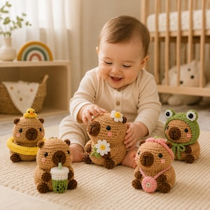 May include: Five small, round, tan crocheted capybara figures. One wears a yellow swim ring with a tiny duck, one holds a green boba tea, one has a white daisy on its head and holds a flower, one wears a pink headband and bag, and one wears a green frog hood.