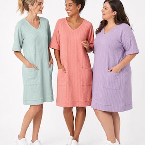 May include: Three knee-length dresses with V-necklines, short sleeves, and two front patch pockets. The dresses feature a vertical cable knit texture and are shown in light mint green, coral pink, and light purple, paired with white sneakers.
