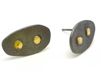 Sterling oval earrings with gold dots.